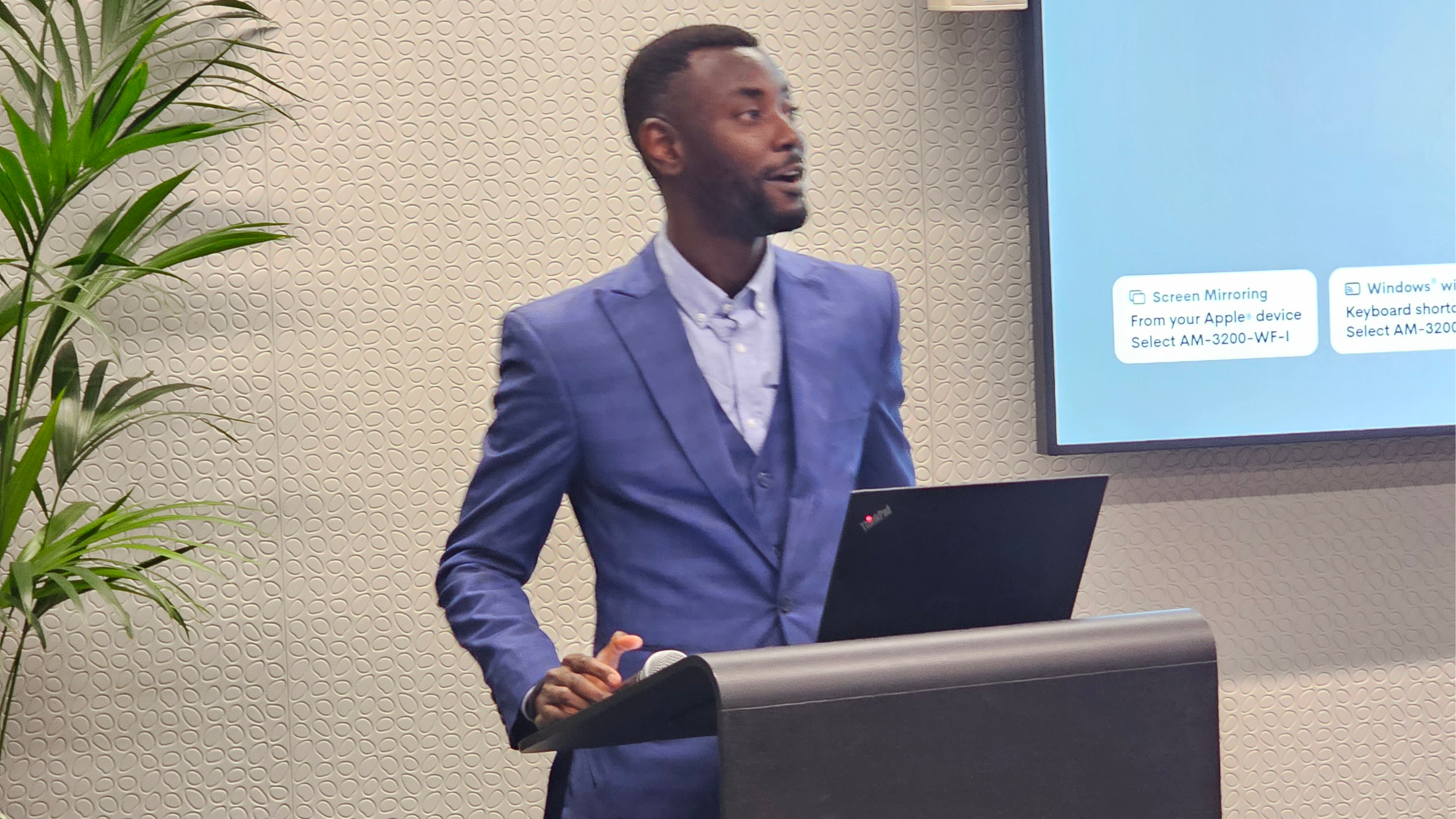 Akinwale engaging with an audience during a stage appearance